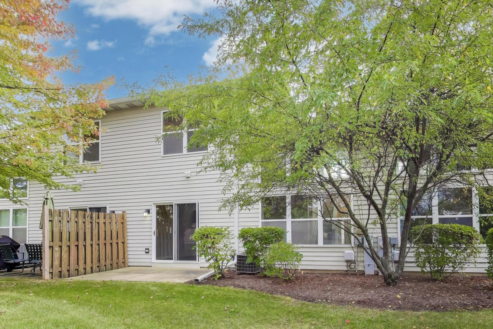 1677 South Candlestick Way Waukegan, IL 60048 - Photo 24 of 30 a front view of a house with a garden