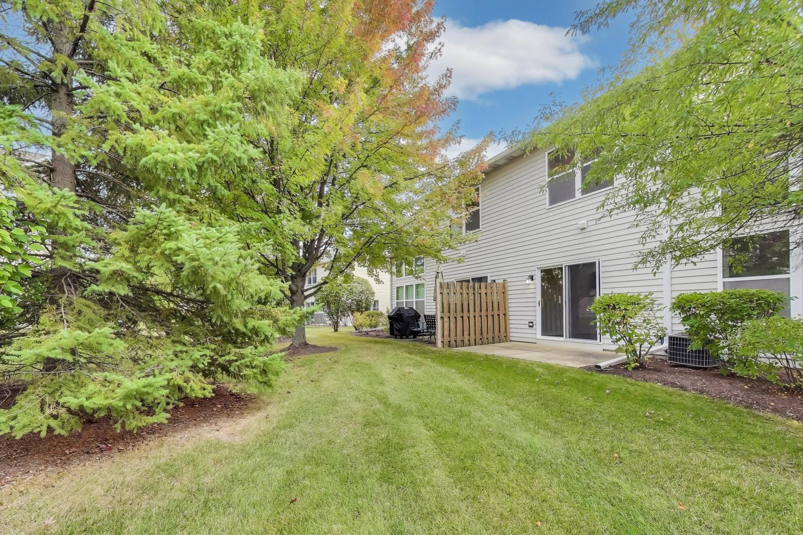 1677 South Candlestick Way Waukegan, IL 60048 - Photo 26 of 30 a view of a house with a yard and sitting area