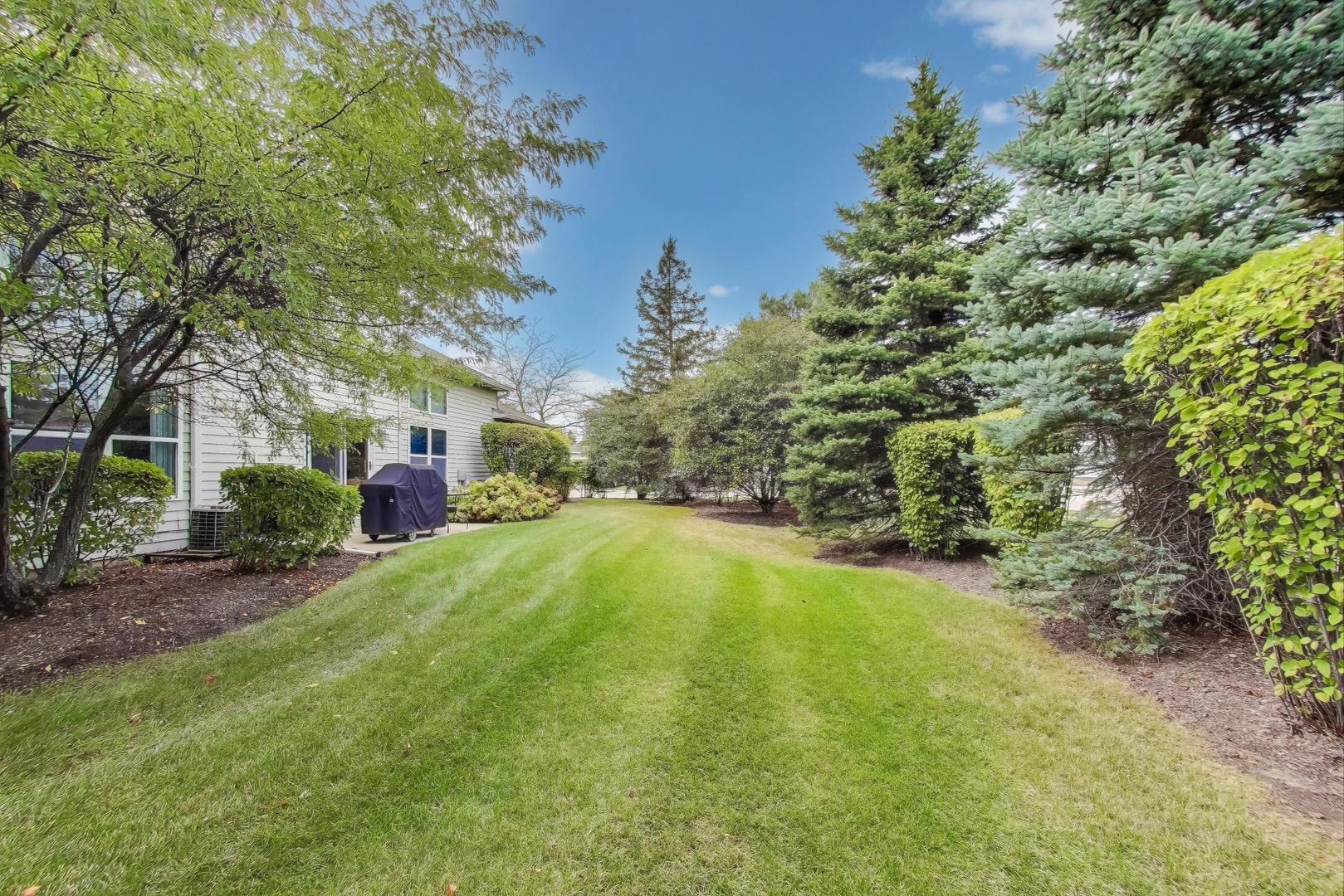 1677 South Candlestick Way Waukegan, IL 60048 - Photo 27 of 30 a swimming pool with trees in the background