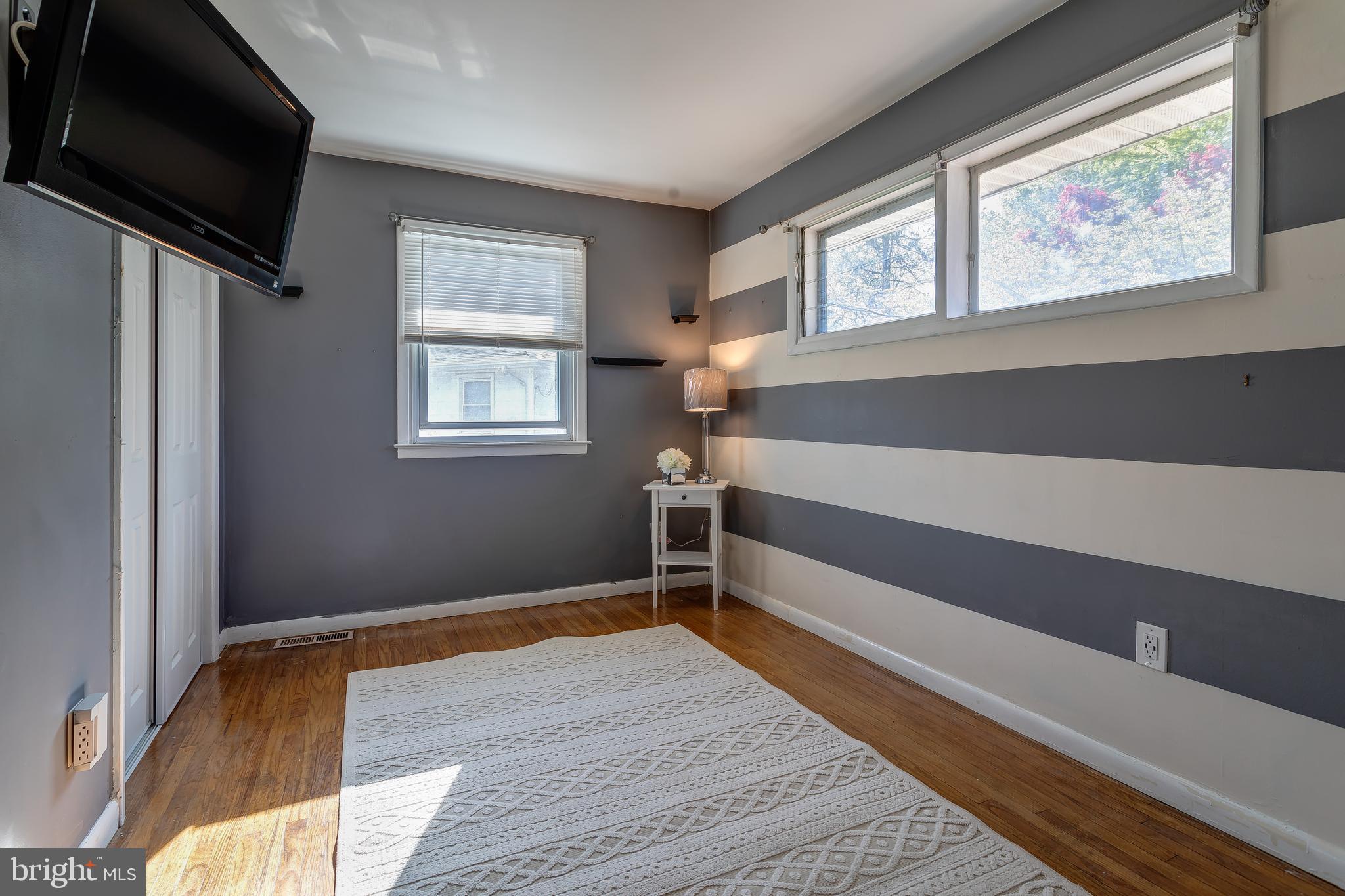 1105 Wynnbrook Road Secane, PA 19018 - Photo 12 of 30 a view of a livingroom with wooden floor and windows