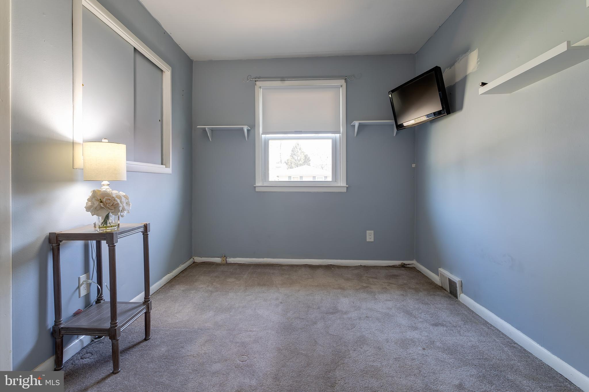 1105 Wynnbrook Road Secane, PA 19018 - Photo 13 of 30 a view of an empty room with tv and wooden floor