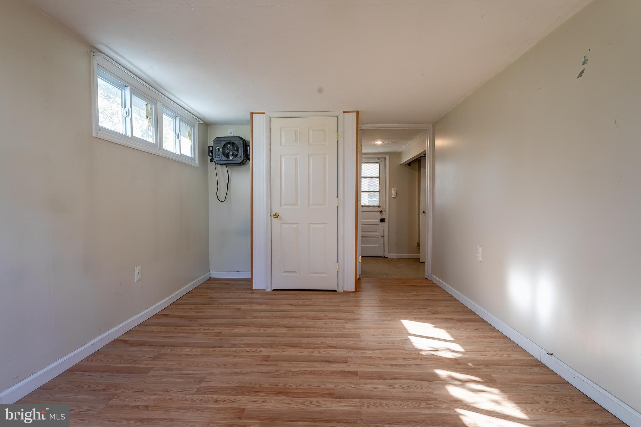 1105 Wynnbrook Road Secane, PA 19018 - Photo 20 of 30 a view of an empty room with window and wooden floor