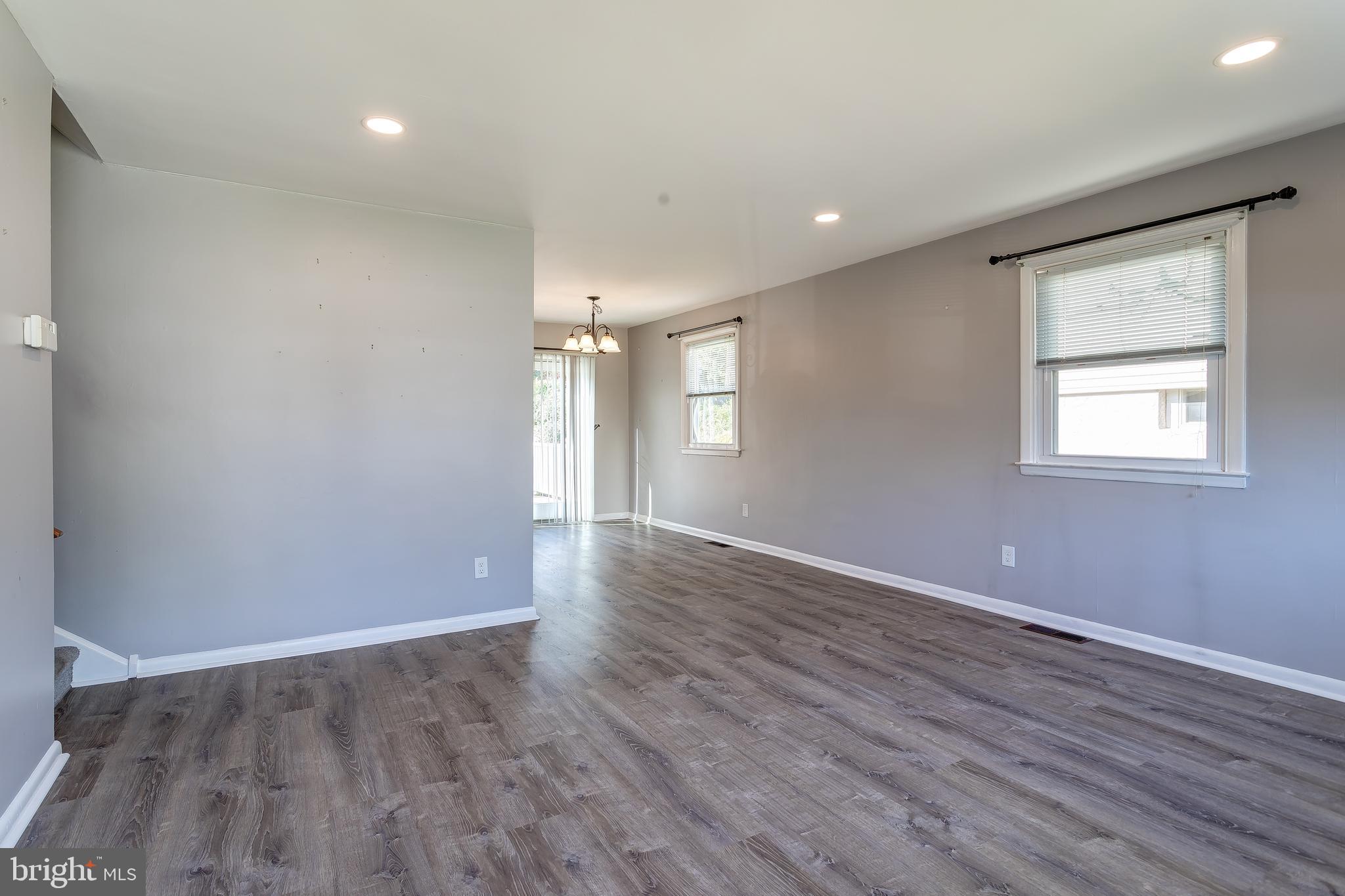 1105 Wynnbrook Road Secane, PA 19018 - Photo 4 of 30 a view of an empty room with wooden floor and a window
