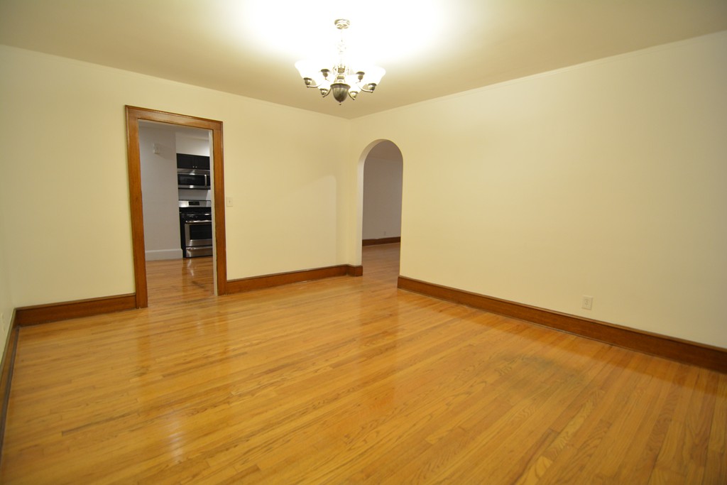 191 Pasco Road Springfield, MA 01151 - Photo 3 of 20 a view of a room with wooden floor and chandelier