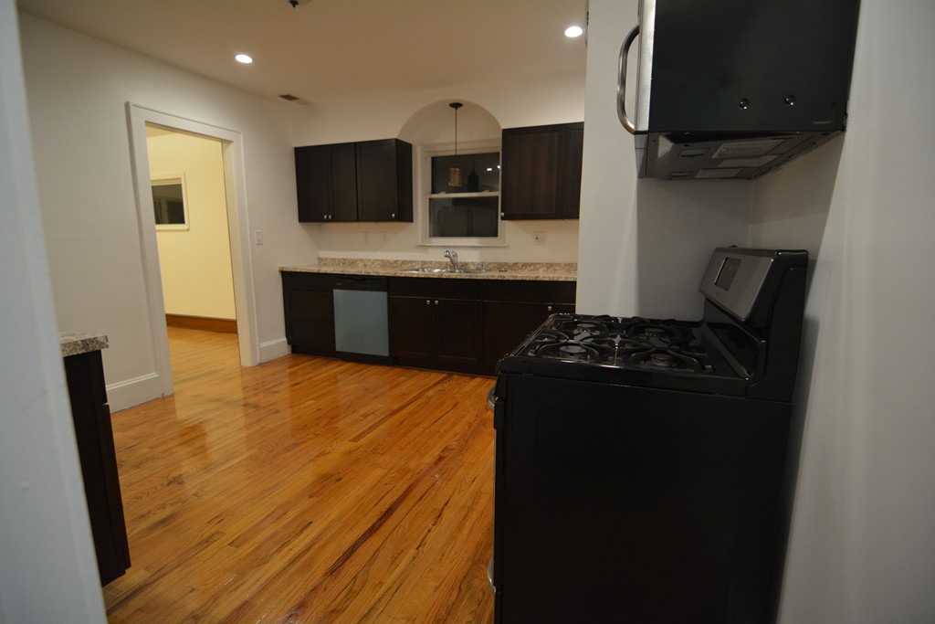 191 Pasco Road Springfield, MA 01151 - Photo 5 of 20 a kitchen with stainless steel appliances a sink stove and refrigerator