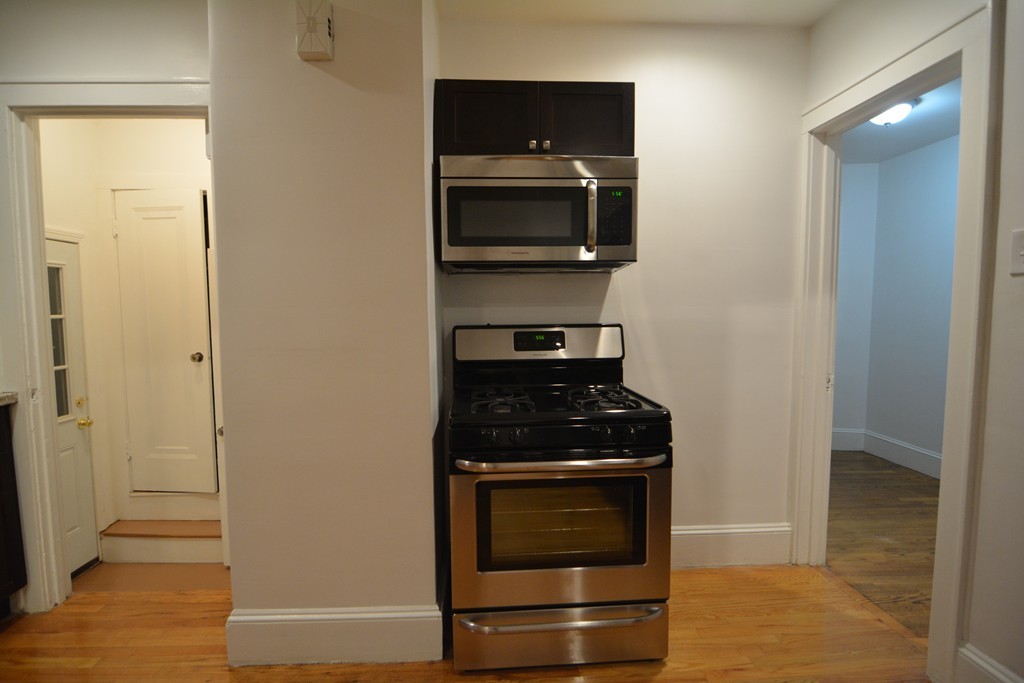 191 Pasco Road Springfield, MA 01151 - Photo 7 of 20 a kitchen with a stove and a microwave