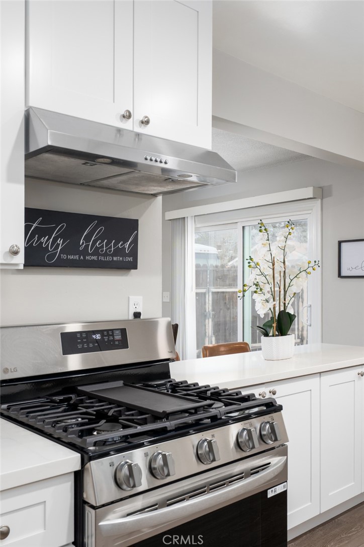 716 Orange Street Riverside, CA 92501 - Photo 9 of 28 a stove top oven sitting inside of a kitchen