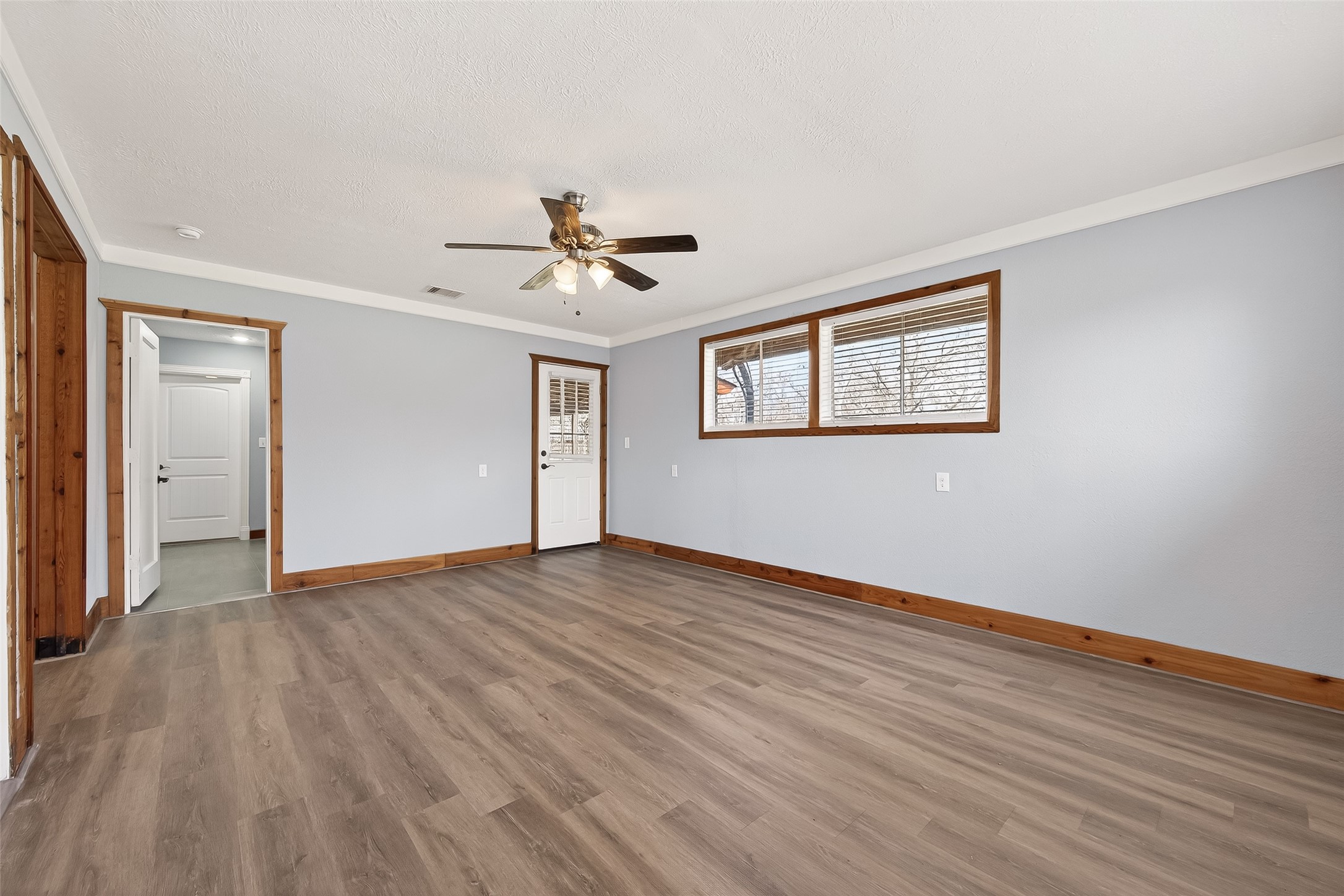 403 Wrangler Road Simonton, TX 77485 - Photo 13 of 33 a view of an empty room with wooden floor and a window