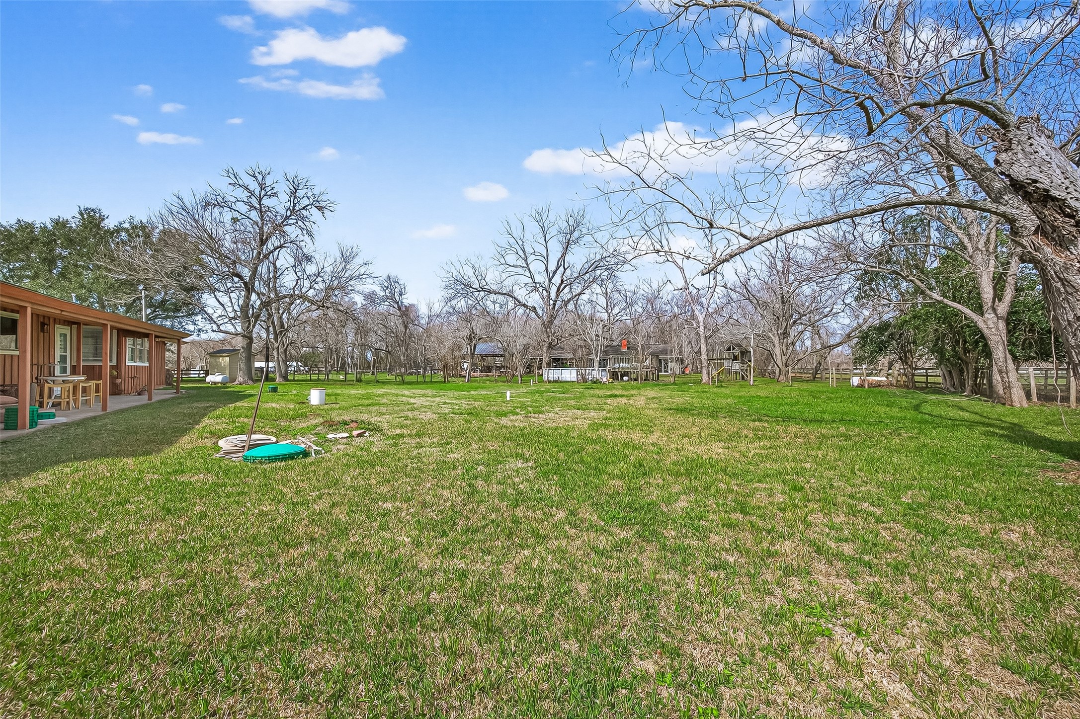 403 Wrangler Road Simonton, TX 77485 - Photo 15 of 33 a view of yard with swimming pool and green space