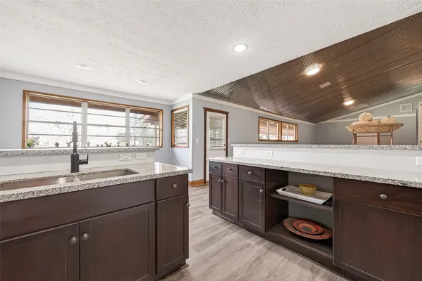 a kitchen with a sink and cabinets