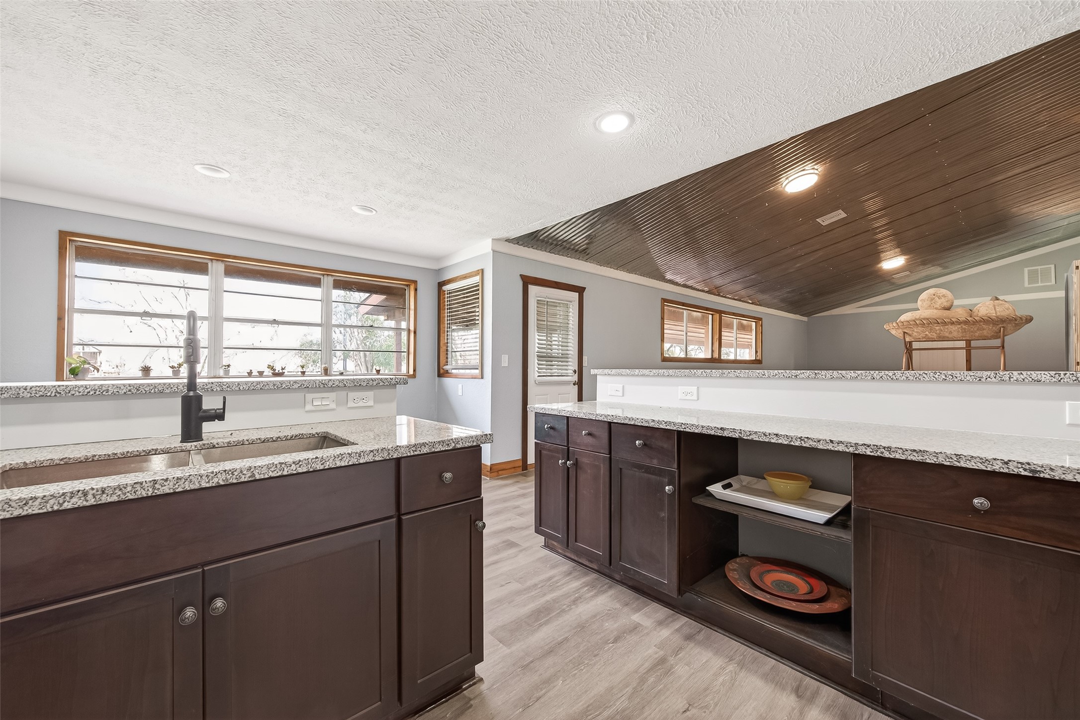 403 Wrangler Road Simonton, TX 77485 - Photo 23 of 33 a kitchen with a sink and cabinets
