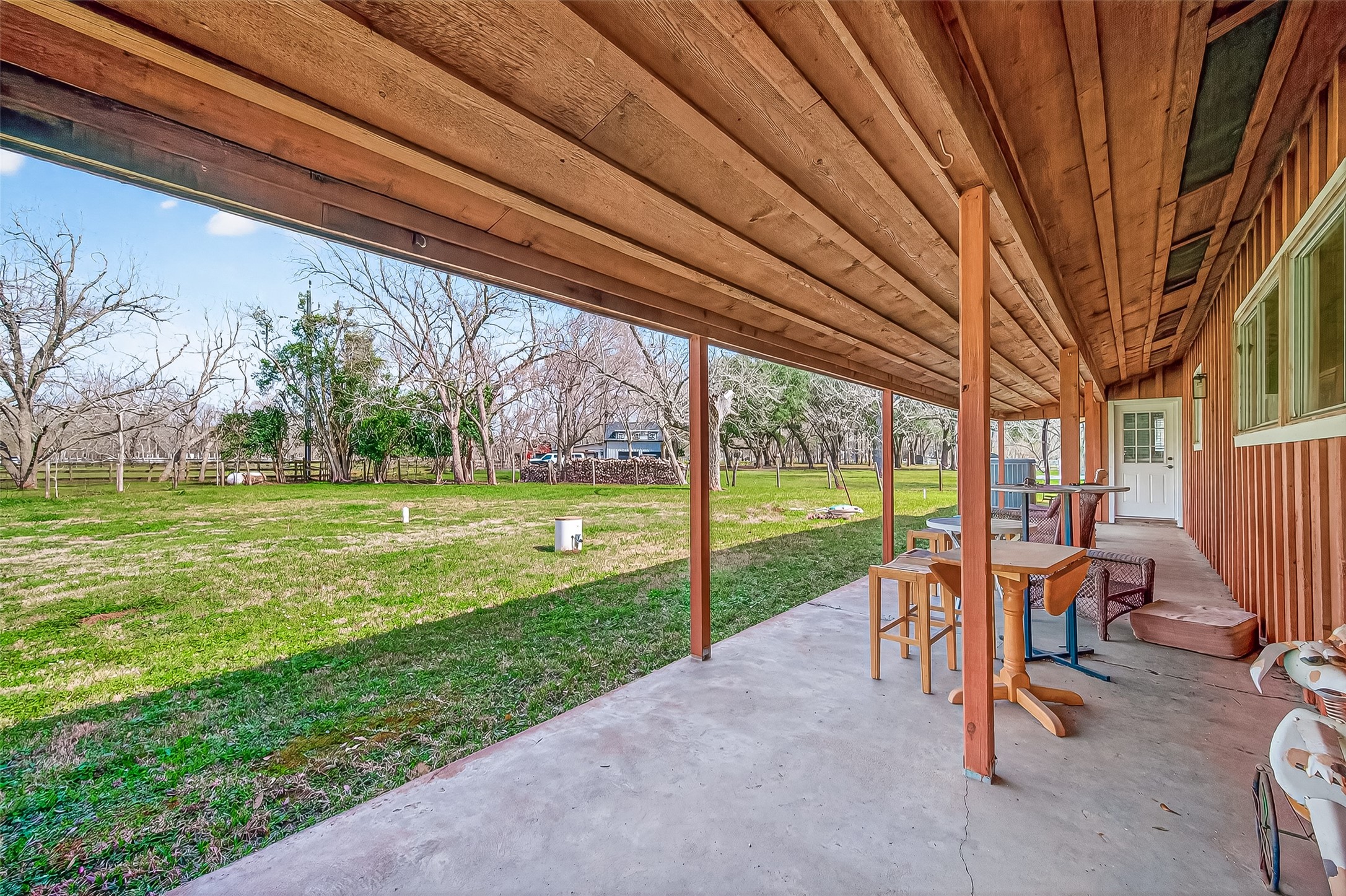 403 Wrangler Road Simonton, TX 77485 - Photo 25 of 33 a view of a house with backyard porch and sitting area