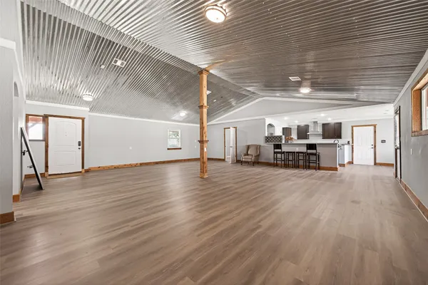 a view of a livingroom with furniture and wooden floor