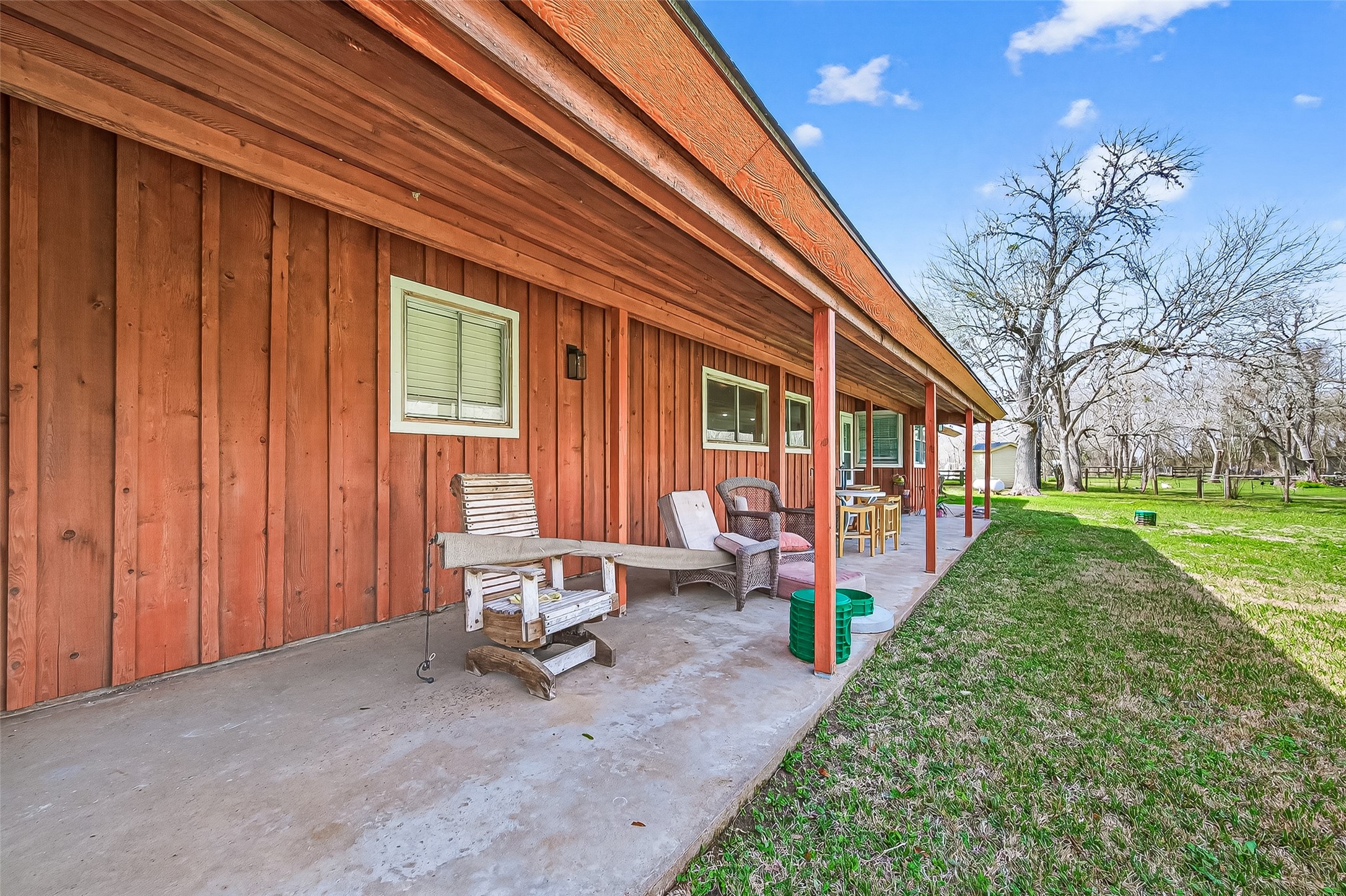 403 Wrangler Road Simonton, TX 77485 - Photo 31 of 33 a backyard of a house with outdoor seating