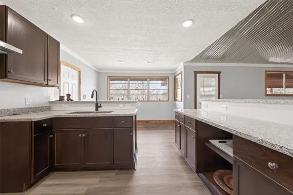 a kitchen with a sink and cabinets