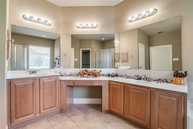a bathroom with a sink vanity and mirror