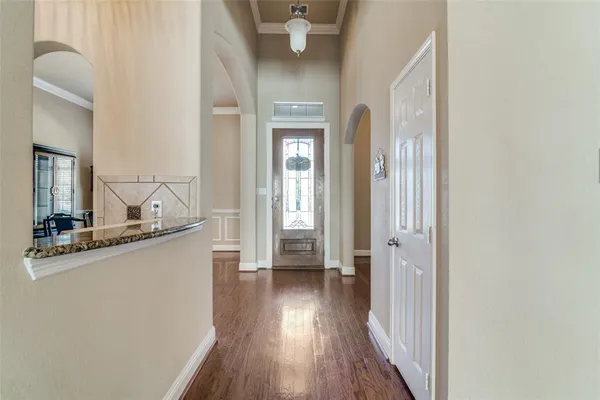 a view of a hallway view with wooden floor