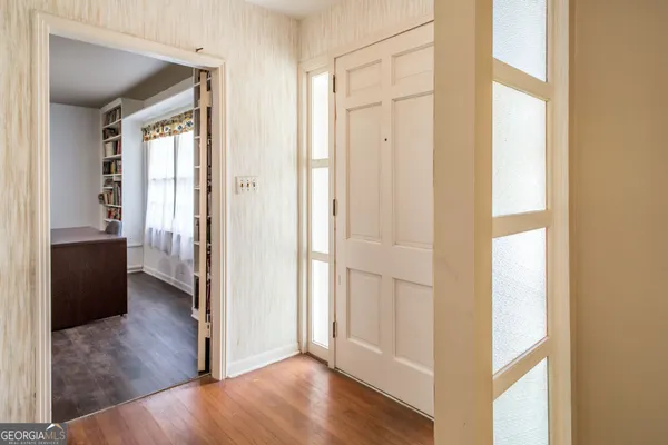 a spacious bedroom with a bed and a table in it