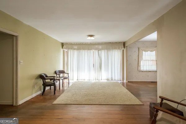 a view of a livingroom with furniture and wooden floor