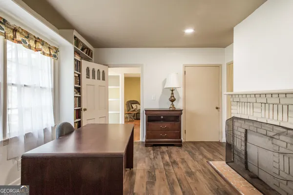 a kitchen with a stove a sink and a refrigerator