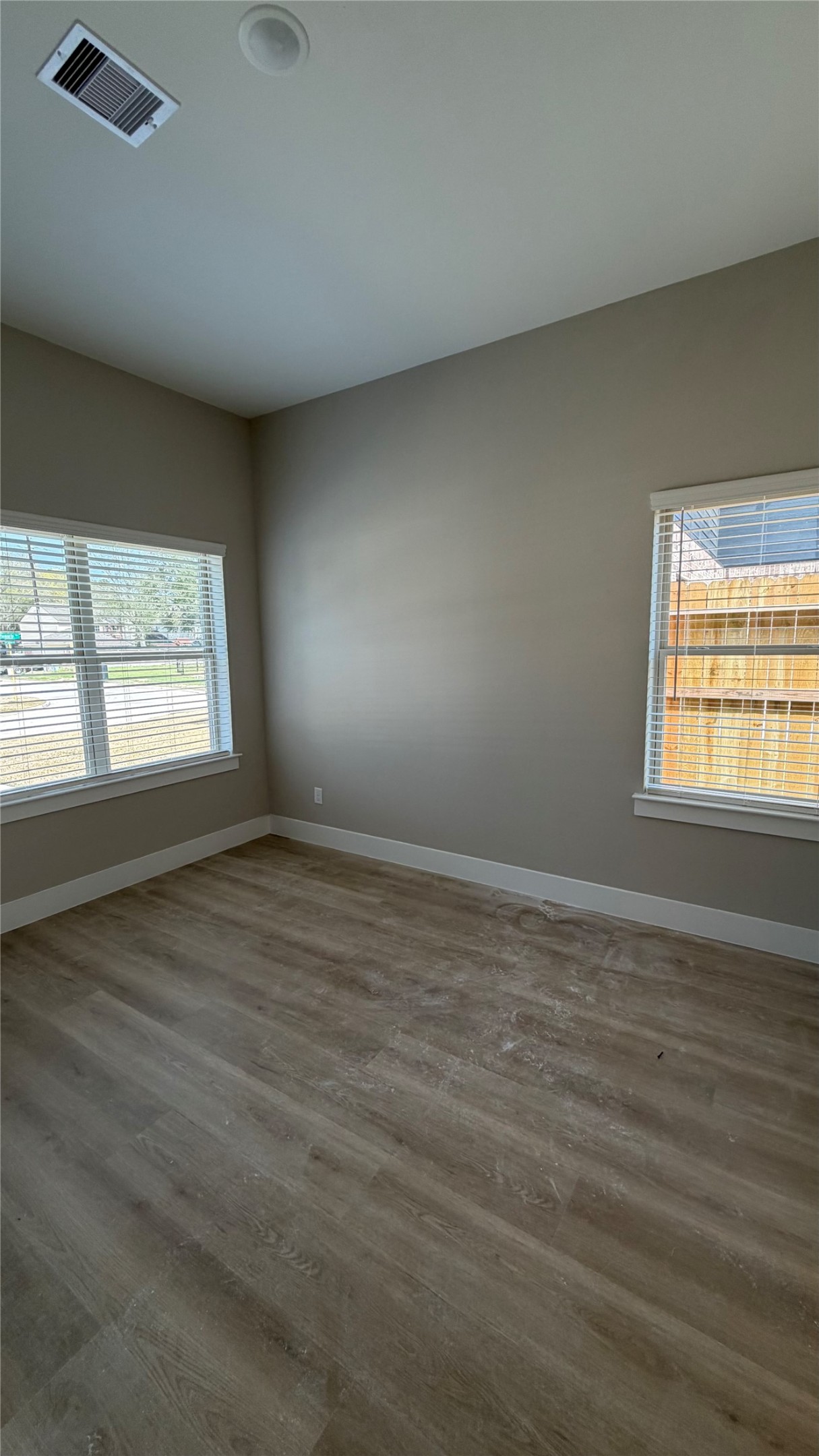 2607 Piemonte Avenue Cir Spring Spring, TX 77388 - Photo 14 of 38 an empty room with wooden floor and windows
