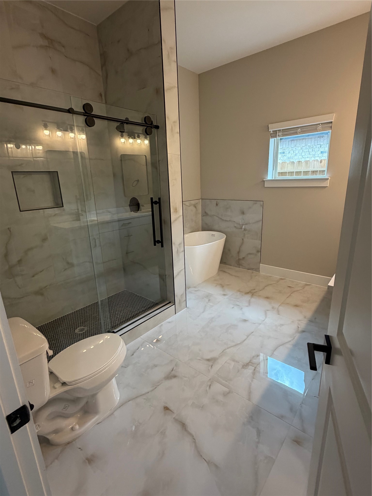 2607 Piemonte Avenue Cir Spring Spring, TX 77388 - Photo 24 of 38 a bathroom with a granite countertop sink toilet and shower