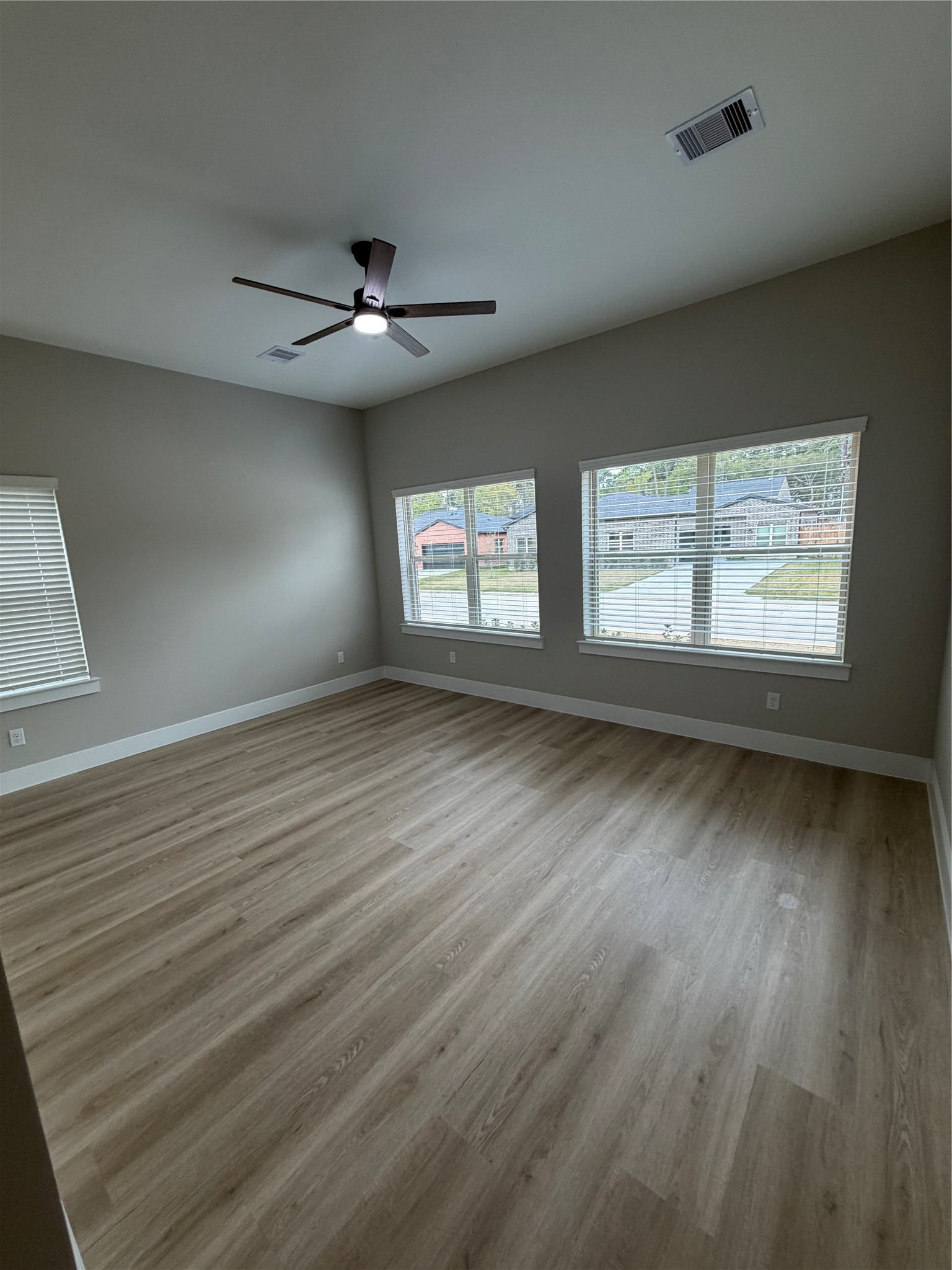 2607 Piemonte Avenue Cir Spring Spring, TX 77388 - Photo 26 of 38 an empty room with wooden floor and windows