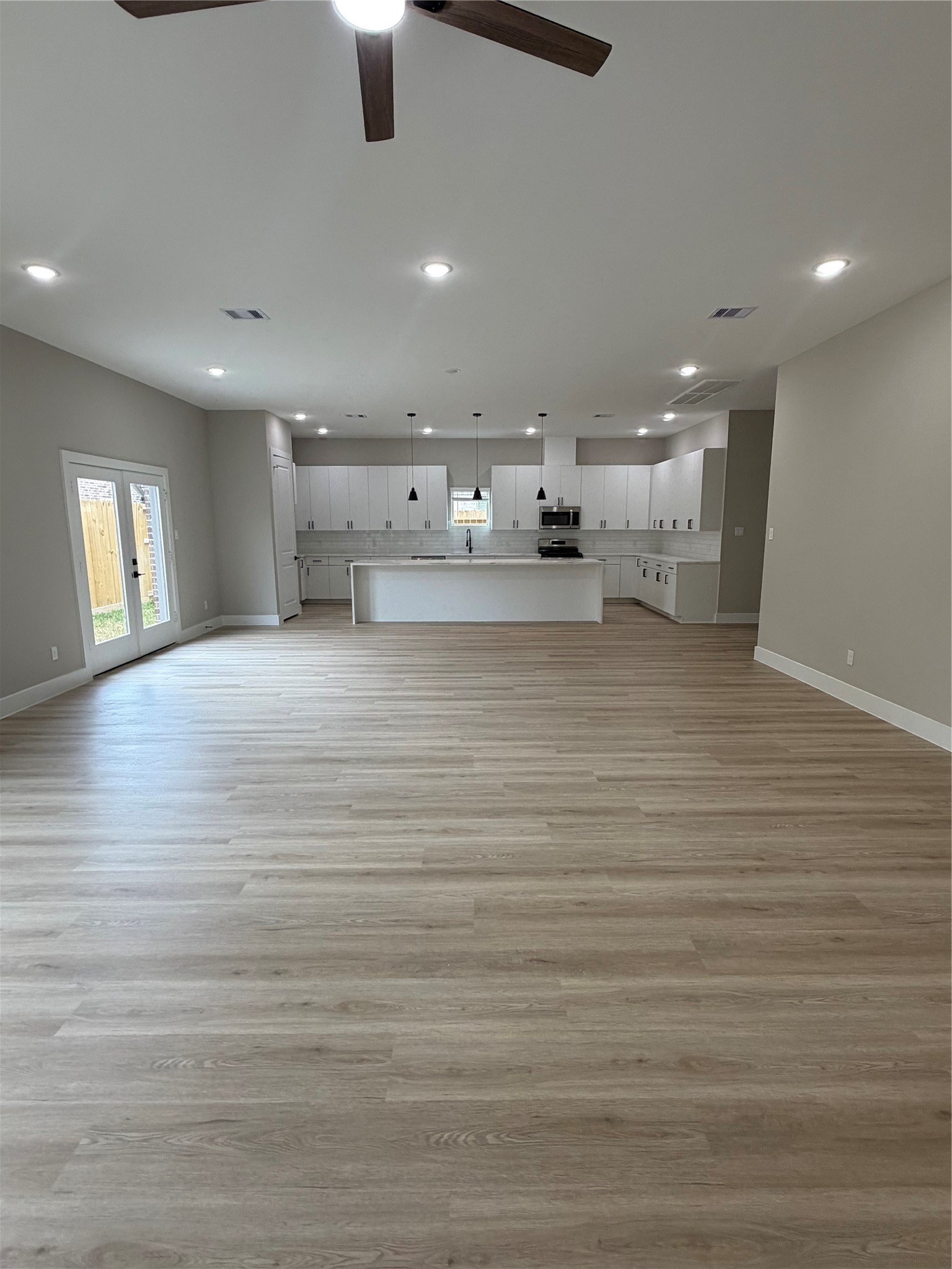 2607 Piemonte Avenue Cir Spring Spring, TX 77388 - Photo 28 of 38 a view of kitchen and hall with wooden floor