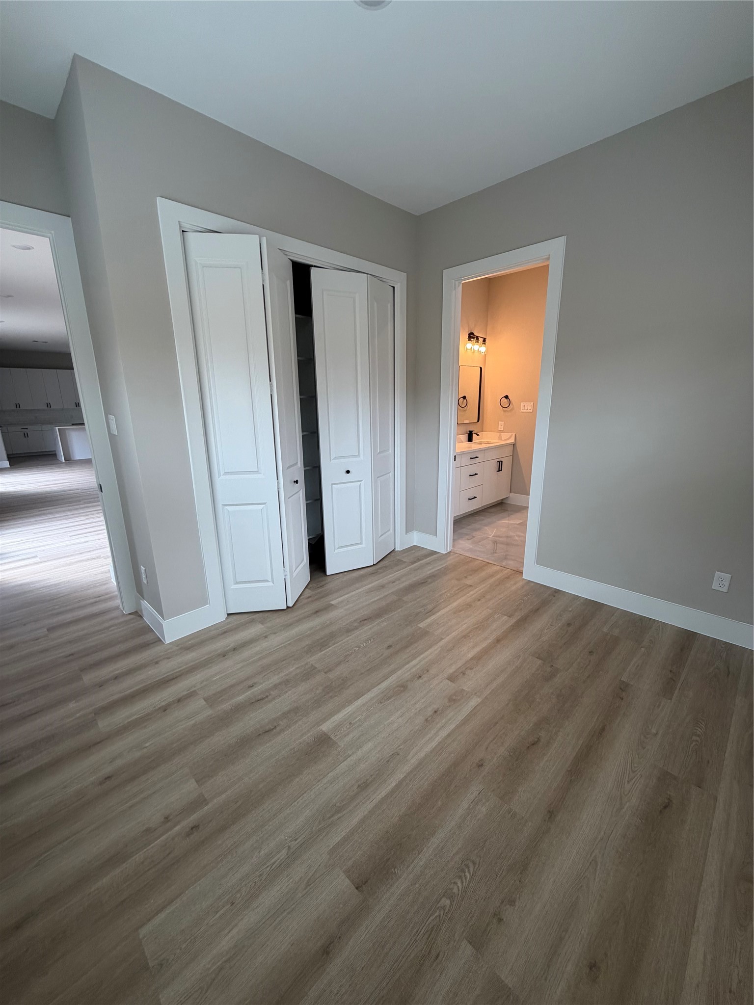 2607 Piemonte Avenue Cir Spring Spring, TX 77388 - Photo 33 of 38 a view of a room with wooden floor and a bathroom