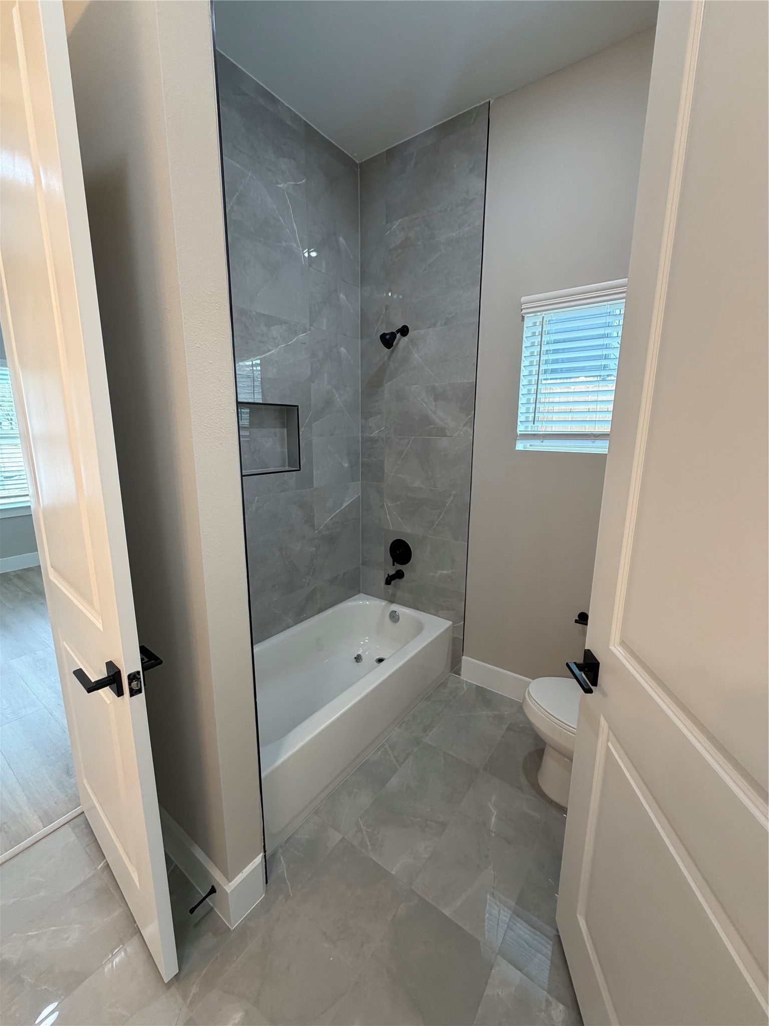 2607 Piemonte Avenue Cir Spring Spring, TX 77388 - Photo 34 of 38 a bathroom with a bathtub a toilet and a shower