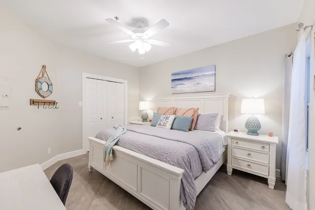 a bed room with a bed and a chandelier