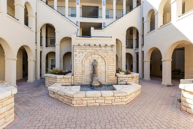 a view of a hallway with a window