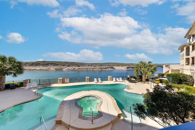 an aerial view of a house with a lake view