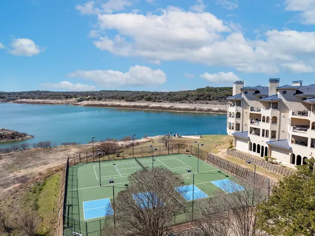 a large building with a large pool in front of it