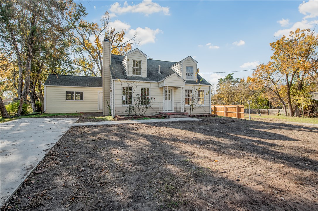 1207 East 27th Street Bryan, TX 77803 - Photo 1 of 23 a front view of a house with a yard