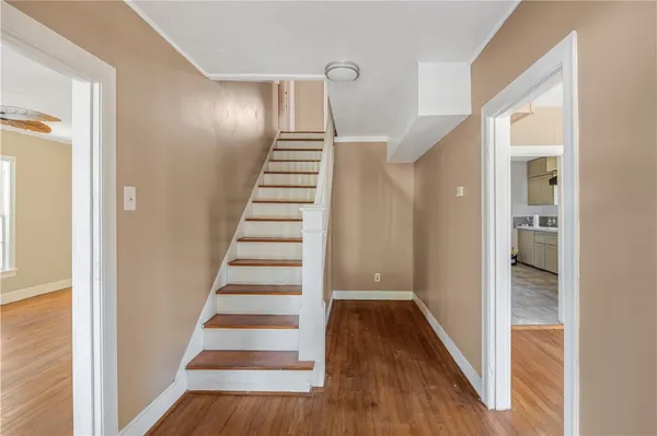 a view of entryway with wooden floor