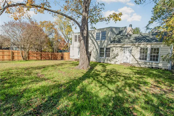 a view of a house with a big yard