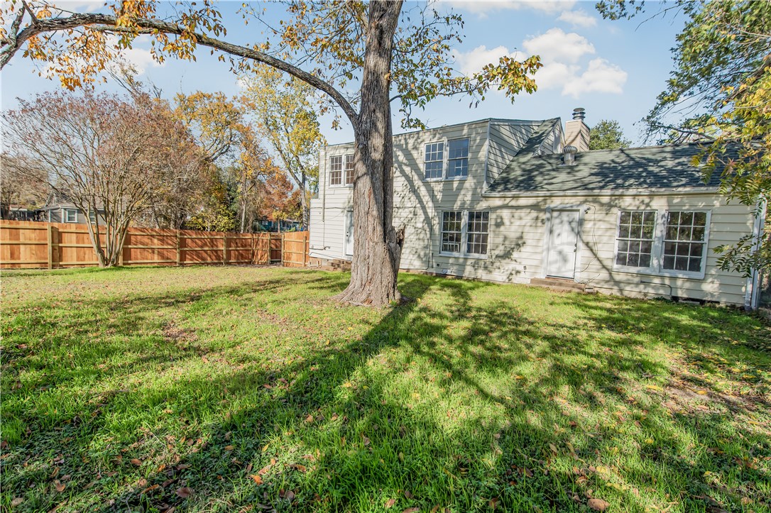 1207 East 27th Street Bryan, TX 77803 - Photo 22 of 23 a view of a house with a big yard