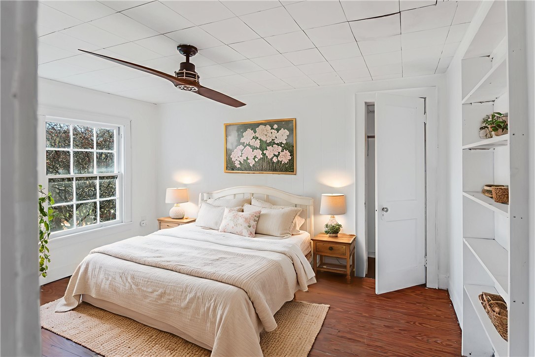 1207 East 27th Street Bryan, TX 77803 - Photo 8 of 23 a bedroom with a large bed and a window