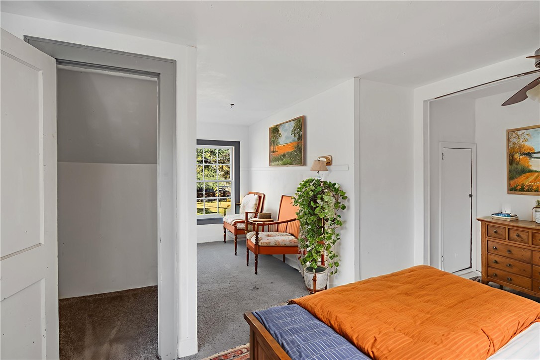 1207 East 27th Street Bryan, TX 77803 - Photo 9 of 23 a bedroom with a bed and a dresser in it