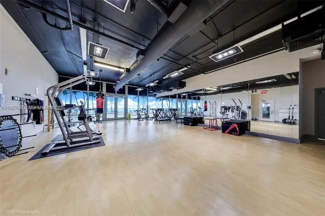 a view of a empty room with gym equipment