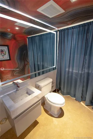 a bathroom with a sink and a toilet