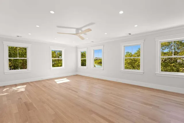 a view of walk in closet with empty racks