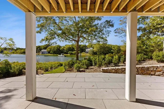 a balcony with trees in front of it