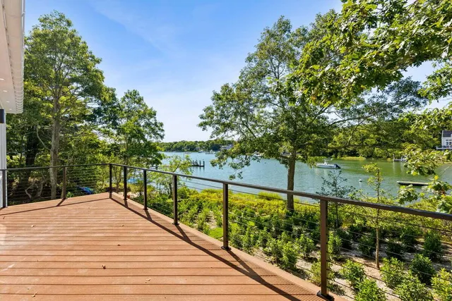 an aerial view of a house with a lake view