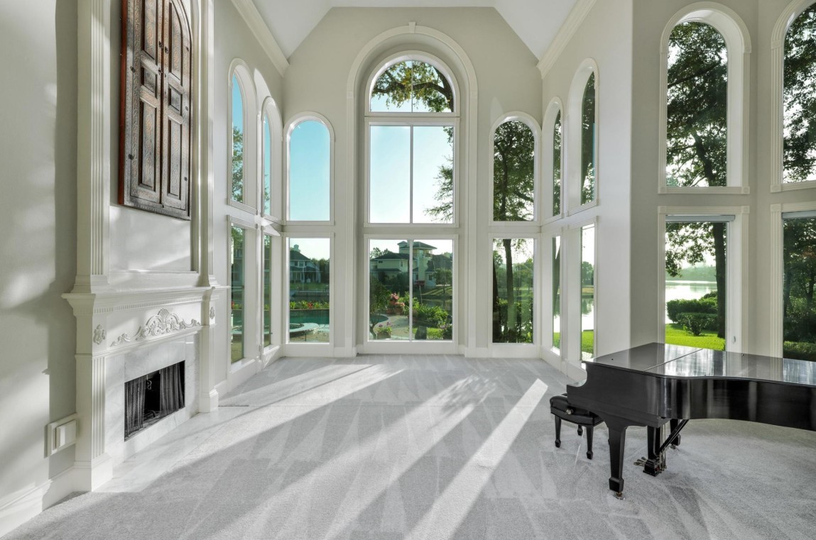 35 West Isle Place The Woodlands, TX 77381 - Photo 14 of 45 Elegant formal entry with dramatic arched windows, marble flooring, and luxurious finishes.
