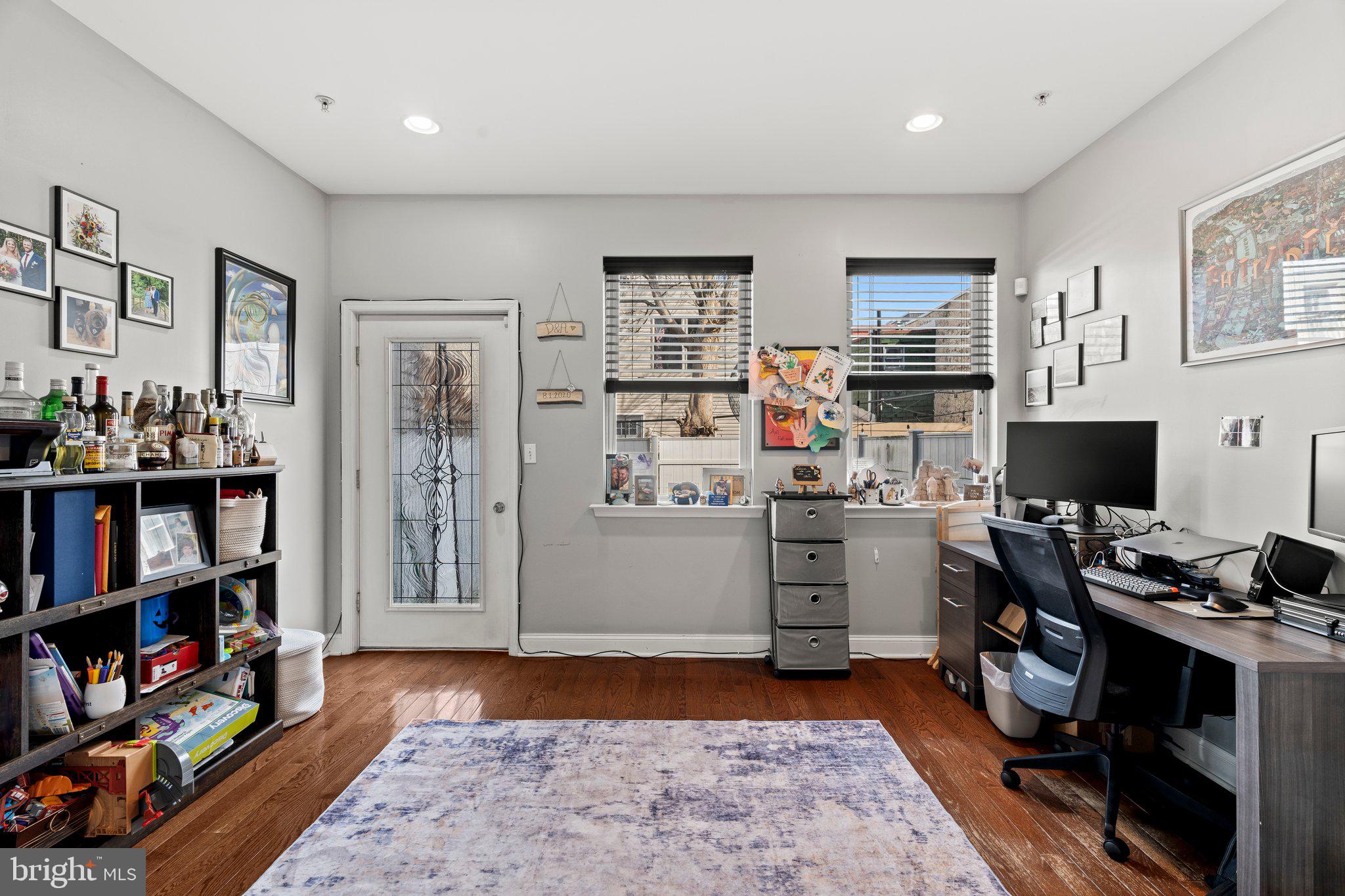 2115 Carpenter Street, Unit 1 Philadelphia, PA 19146 - Photo 12 of 24 a view of a workspace with furniture and bookshelf
