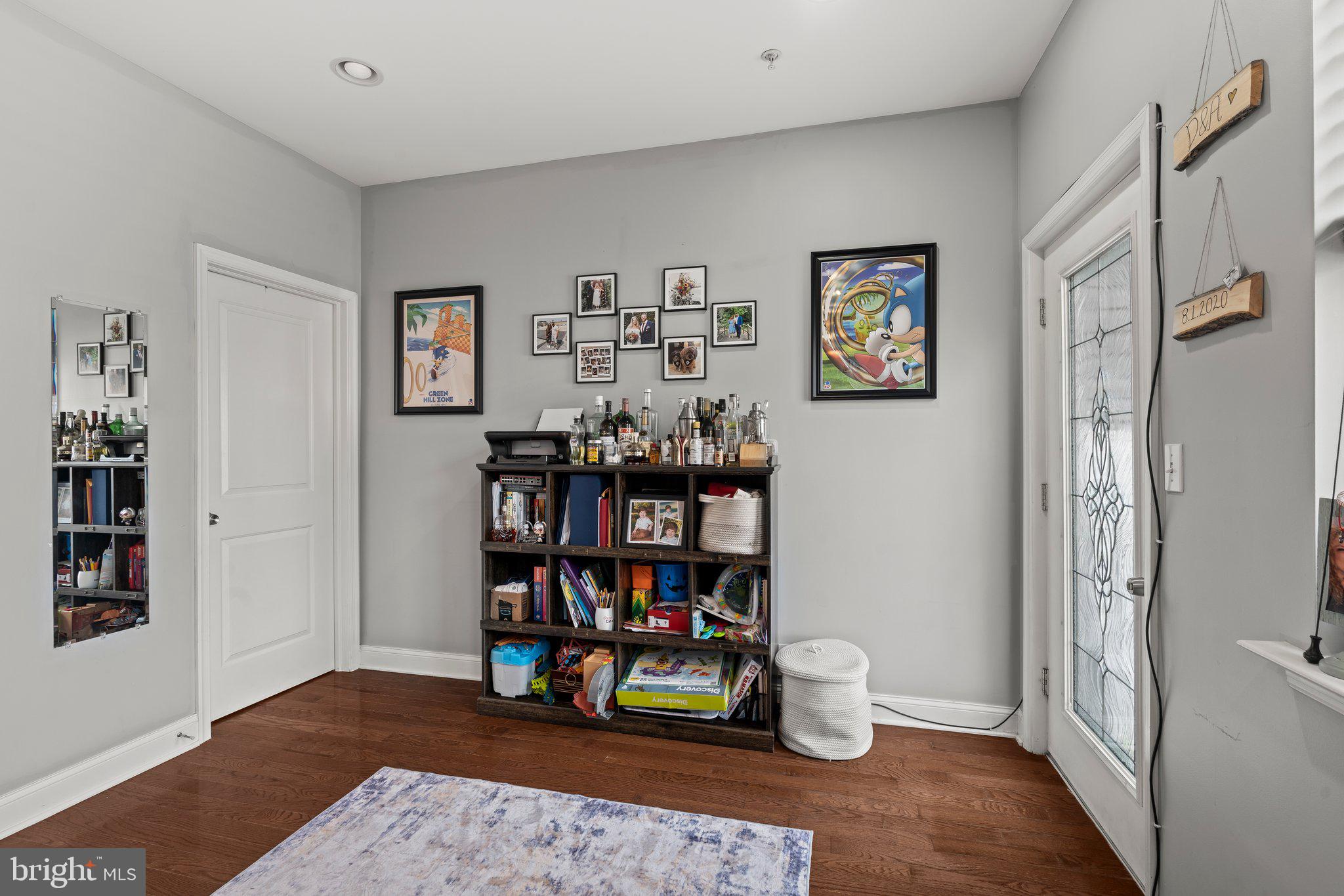 2115 Carpenter Street, Unit 1 Philadelphia, PA 19146 - Photo 14 of 24 a room with lots of books and a painting on the wall