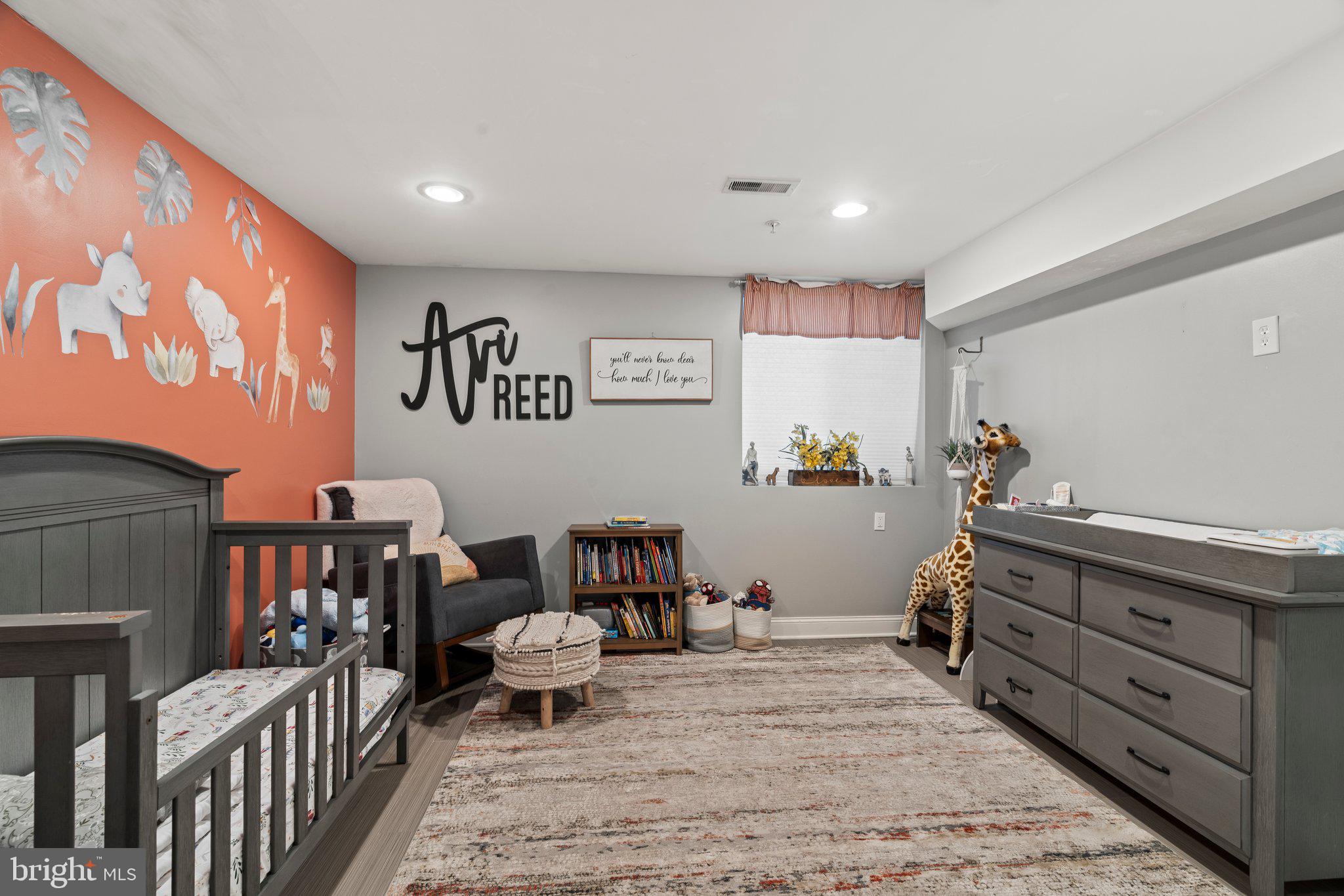2115 Carpenter Street, Unit 1 Philadelphia, PA 19146 - Photo 17 of 24 a bed room with furniture and a baby crib