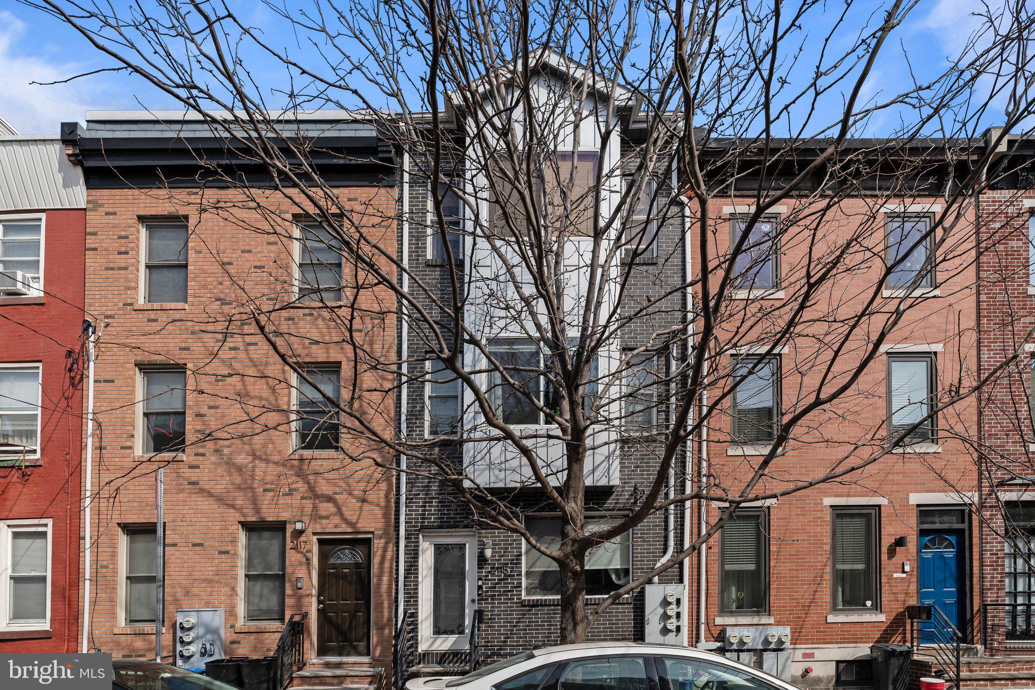 2115 Carpenter Street, Unit 1 Philadelphia, PA 19146 - Photo 2 of 24 a view of a street with houses